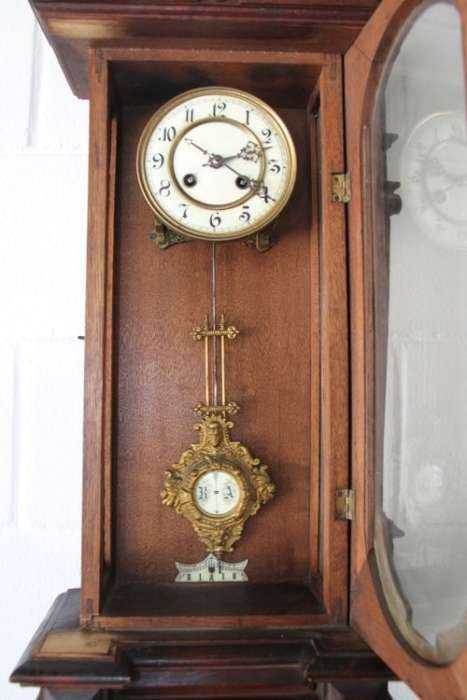 A spectacular antique (c.1890) German regulatory pendulum wall clock with a porcelain clock face