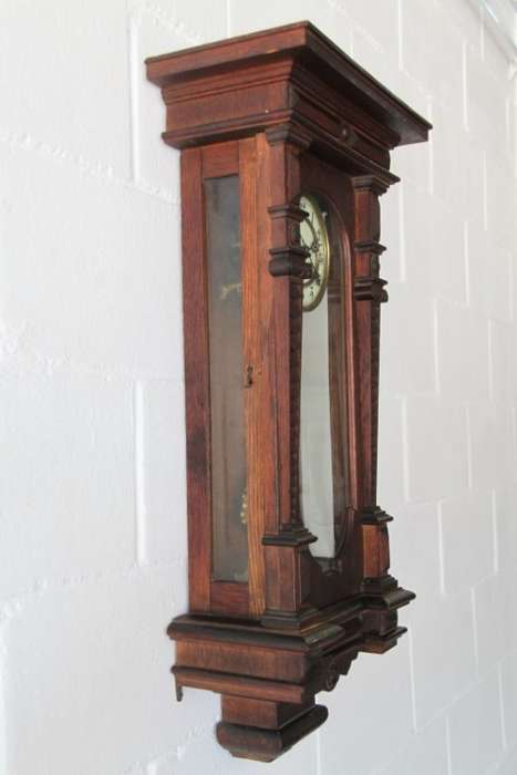 A spectacular antique (c.1890) German regulatory pendulum wall clock with a porcelain clock face