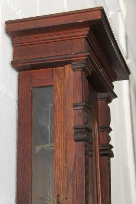 A spectacular antique (c.1890) German regulatory pendulum wall clock with a porcelain clock face