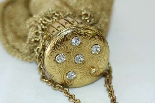 A beautiful vintage Art Deco "gold" wire mesh ladies formal evening bag with diamante in the lid