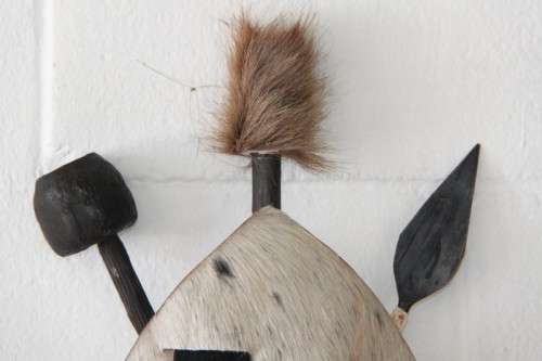 An amazing traditional Zulu cowhide shield with a spear and knobkierie