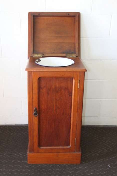 A stunning antique oak gentleman's wash stand with cupboard & a shelf and its original enamel bowl