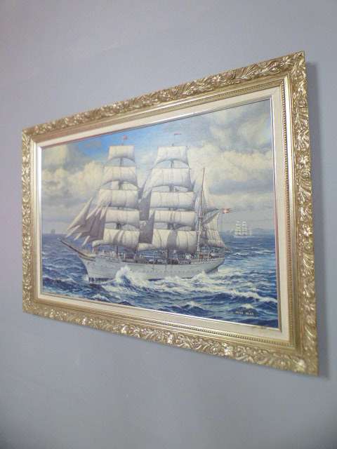 A beautiful signed and framed "Peter Bilas" oil painting of a sailing ship in an ornate frame