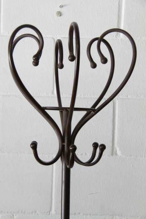 A stunning tall wrought iron coat rack/ hat stand with loads of space in very good condition