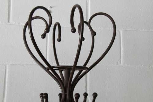 A stunning tall wrought iron coat rack/ hat stand with loads of space in very good condition