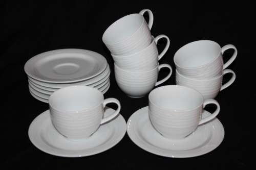 A set of Noritake "Arctic White" porcelain - 7 cups and 8 saucers in amazing condition