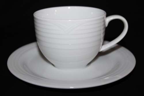 A set of Noritake "Arctic White" porcelain - 7 cups and 8 saucers in amazing condition