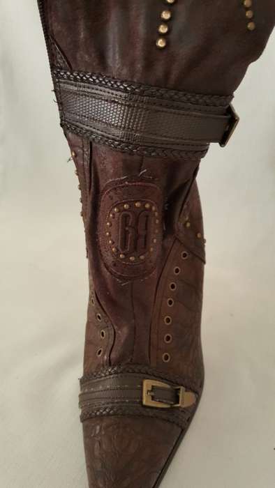 A beautiful and very sexy pair of brown ladies 1to3 mid-calf "studded" stiletto heel zip-up boots
