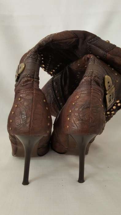 A beautiful and very sexy pair of brown ladies 1to3 mid-calf "studded" stiletto heel zip-up boots