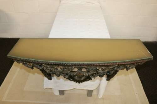 A fabulous antique wall mountable display shelf with amazing ormolu detailing and a glass top