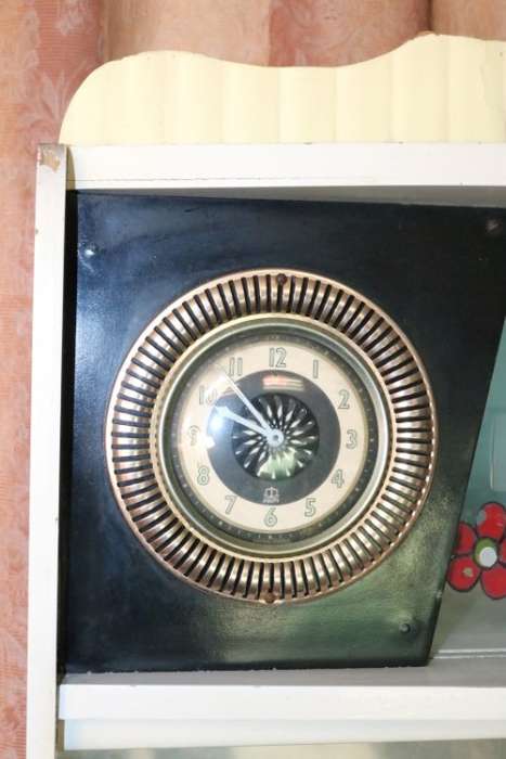 A fantastic Art Deco "hoosier kitchen cabinet" with loads of cupboard space and a built in clock