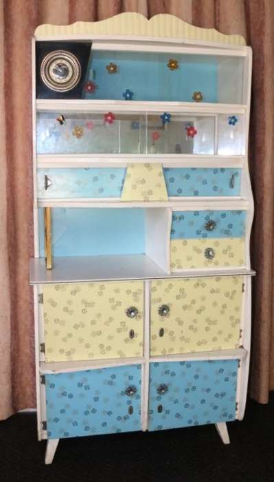 A fantastic Art Deco "hoosier kitchen cabinet" with loads of cupboard space and a built in clock