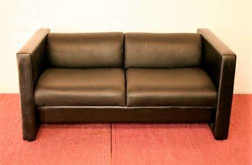 An awesome and stylish black bonded leather 2-seater "Tuxedo" couch in stunning condition