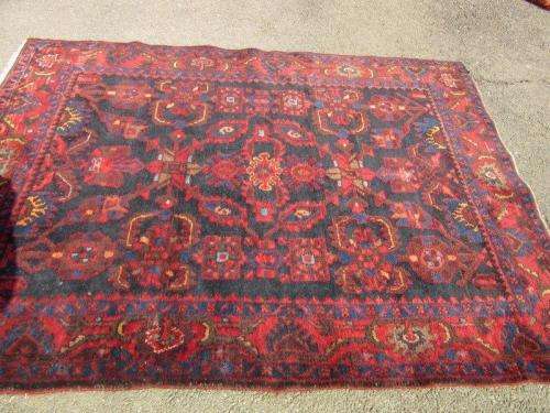 An amazing vintage Persian Carpet (1.9m x 1.4m) in deep red, blue and black detailing - wow!