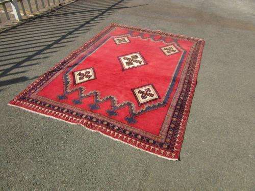 A magnificent vintage Iranian "Sirjani" Bokhtiari Kilim Persian carpet in vibrant red, blues, cream