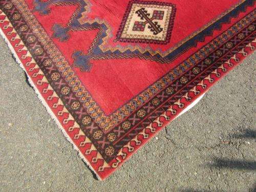 A magnificent vintage Iranian "Sirjani" Bokhtiari Kilim Persian carpet in vibrant red, blues, cream