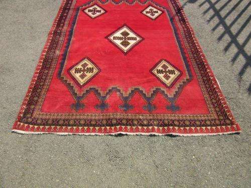 A magnificent vintage Iranian "Sirjani" Bokhtiari Kilim Persian carpet in vibrant red, blues, cream