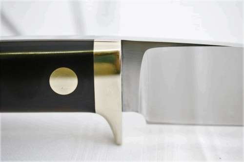 An awesome Piet Cirey "skinning" knife with brass trimmings in its original leather sheath