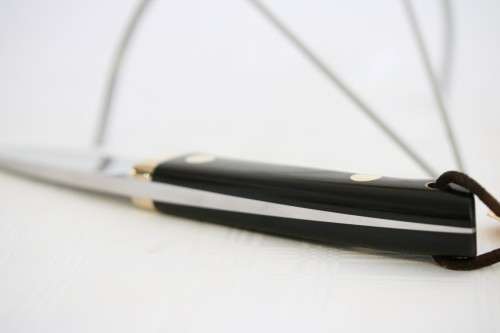 An awesome Piet Cirey "skinning" knife with brass trimmings in its original leather sheath