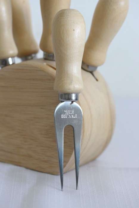 A wonderful stainless steel cheese knives and fork set in a wooden holder - an amazing gift!
