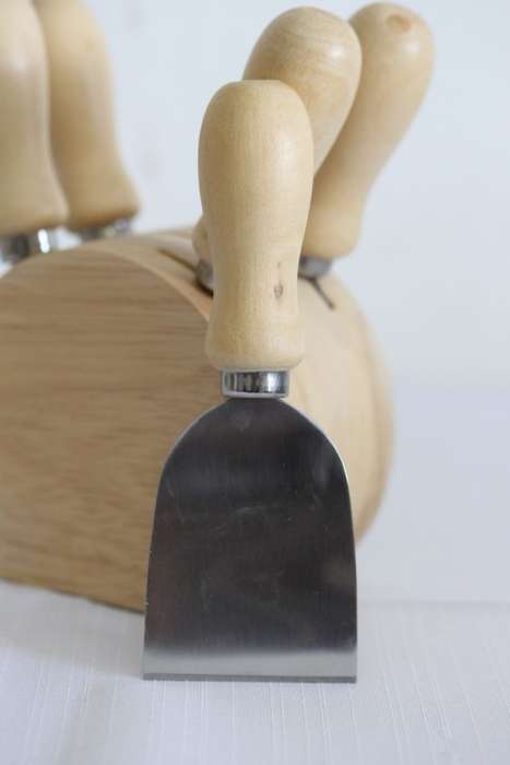 A wonderful stainless steel cheese knives and fork set in a wooden holder - an amazing gift!