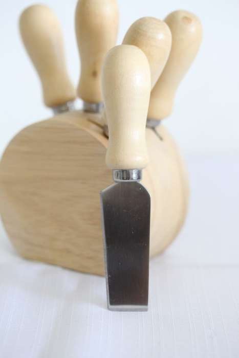 A wonderful stainless steel cheese knives and fork set in a wooden holder - an amazing gift!