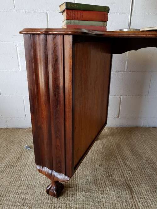 A very charming vintage Imbuia Ball and Claw desk with 3x spacious drawers, shelf and brass handles!