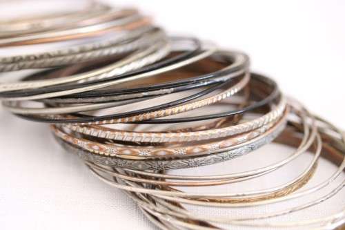 A wonderful collection of 41x ladies metal bangles including silver metal, brass and more