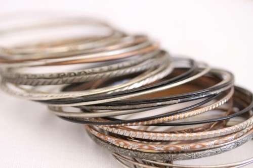 A wonderful collection of 41x ladies metal bangles including silver metal, brass and more