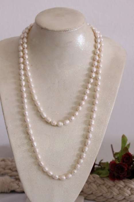 A beautiful 126cm endless-strand of white cultured baroque pearls in stunning condition