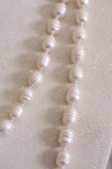 A beautiful 126cm endless-strand of white cultured baroque pearls in stunning condition