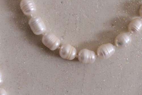 A beautiful 126cm endless-strand of white cultured baroque pearls in stunning condition