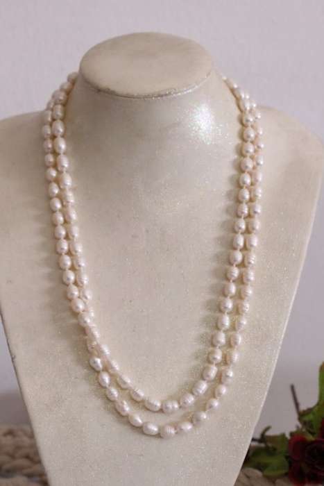 A beautiful 126cm endless-strand of white cultured baroque pearls in stunning condition