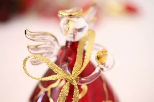**RS17** A made hand-blown Italian red-glass angel finished with gold detailing by Flamigni