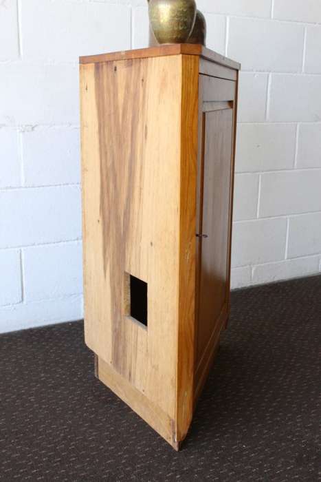 A lovely Oak single-door corner cabinet with shelves on the inside. Perfect for smaller spaces!!