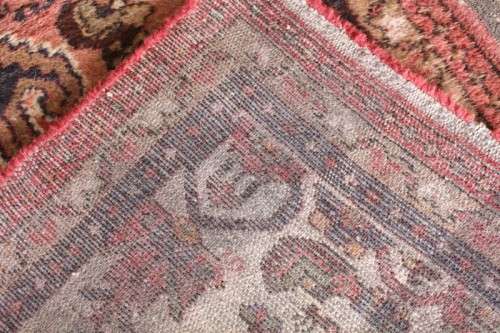 An awesome vintage/ antique? hand dyed Persian carpet (127cm x 80cm) with red and earthy tones