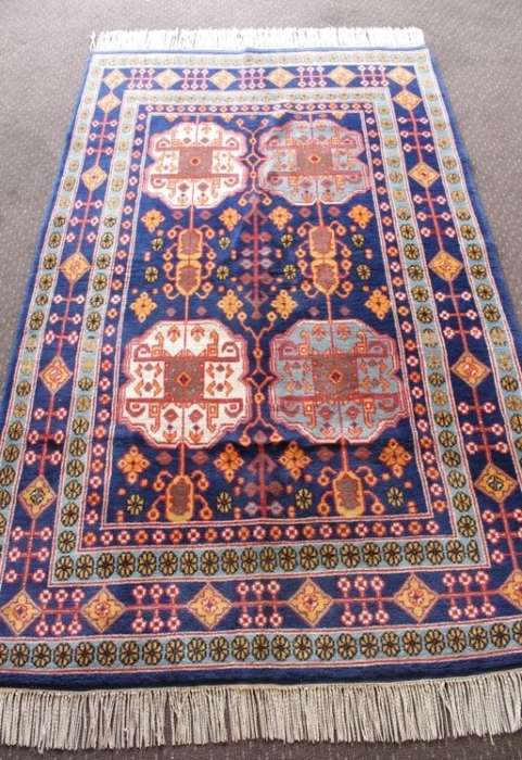 A beautiful and very well made colourful Russian Derbent carpet in light & dark blue, reds and rust