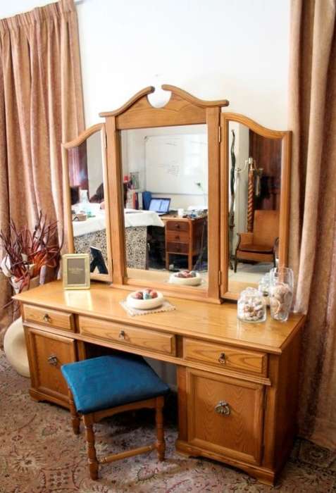 An exquisite, large Oak three drawer side-folding mirror dressing table with two cupboards and stool