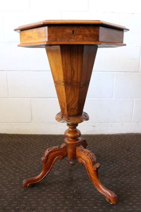 **RS17** An antique (c1890's) Victorian walnut octagonal sewing table w/ an array of compartments