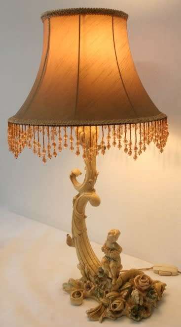 A gorgeous ornate alabastrine oxylite table lamp with stunning detailing and a stylish shade.