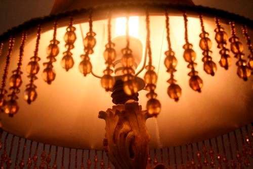 A gorgeous ornate alabastrine oxylite table lamp with stunning detailing and a stylish shade.