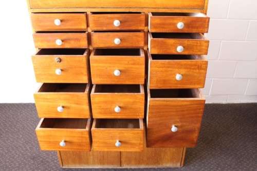 An awesome mid-century 14-drawer Apothecary cabinet with a double door cupboard and preparation top