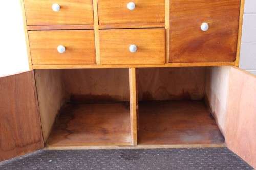 An awesome mid-century 14-drawer Apothecary cabinet with a double door cupboard and preparation top