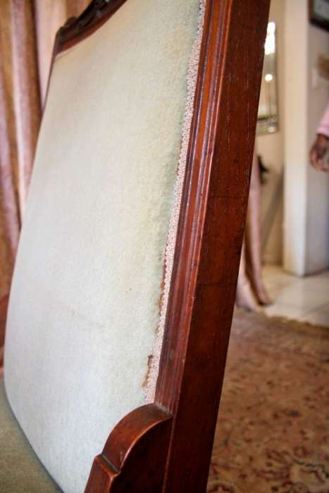 **RS17**  A hand-carved antique Victorian slipper/ nursing chair upholstered in a soft green fabric