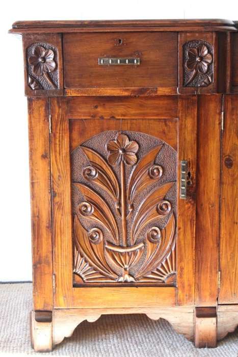 A gorgeous Victorian heavily carved solid Oak three-door side server with loads of drawer space!