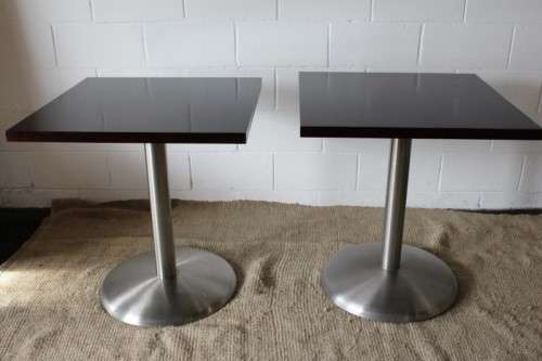 A stylish square mahogany wood-top cafe table with a brushed steel centre leg - two available