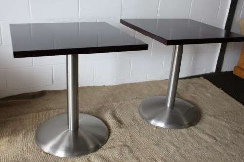 A stylish square mahogany wood-top cafe table with a brushed steel centre leg - two available
