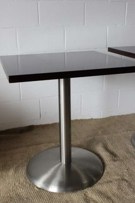A stylish square mahogany wood-top cafe table with a brushed steel centre leg - two available