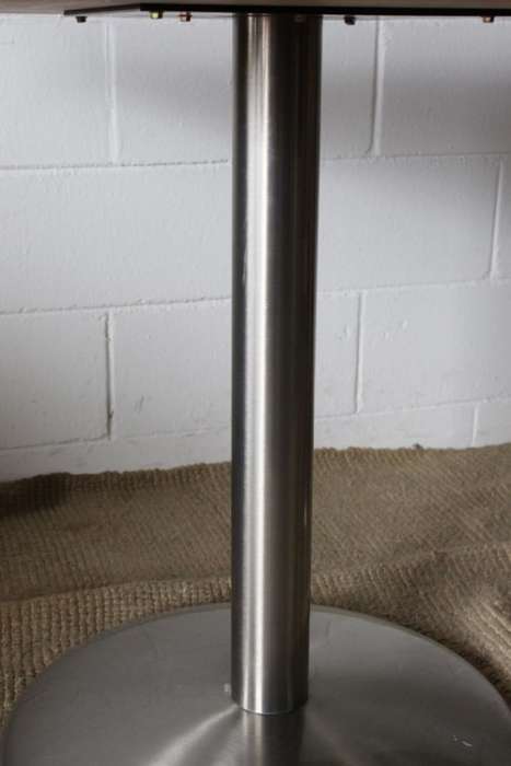 A stylish square mahogany wood-top cafe table with a brushed steel centre leg - two available