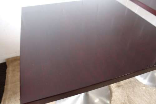 A stylish square mahogany wood-top cafe table with a brushed steel centre leg - two available